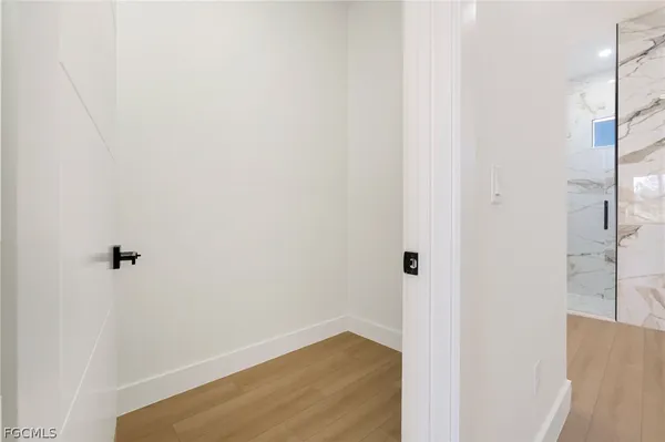 a view of a hallway with closet