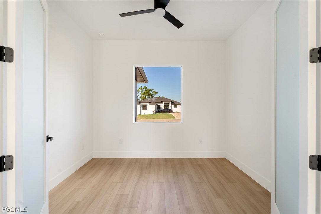 95 Brig Circle East Placida, FL 33946 - Photo 5 of 25 an empty room with a window and a ceiling fan