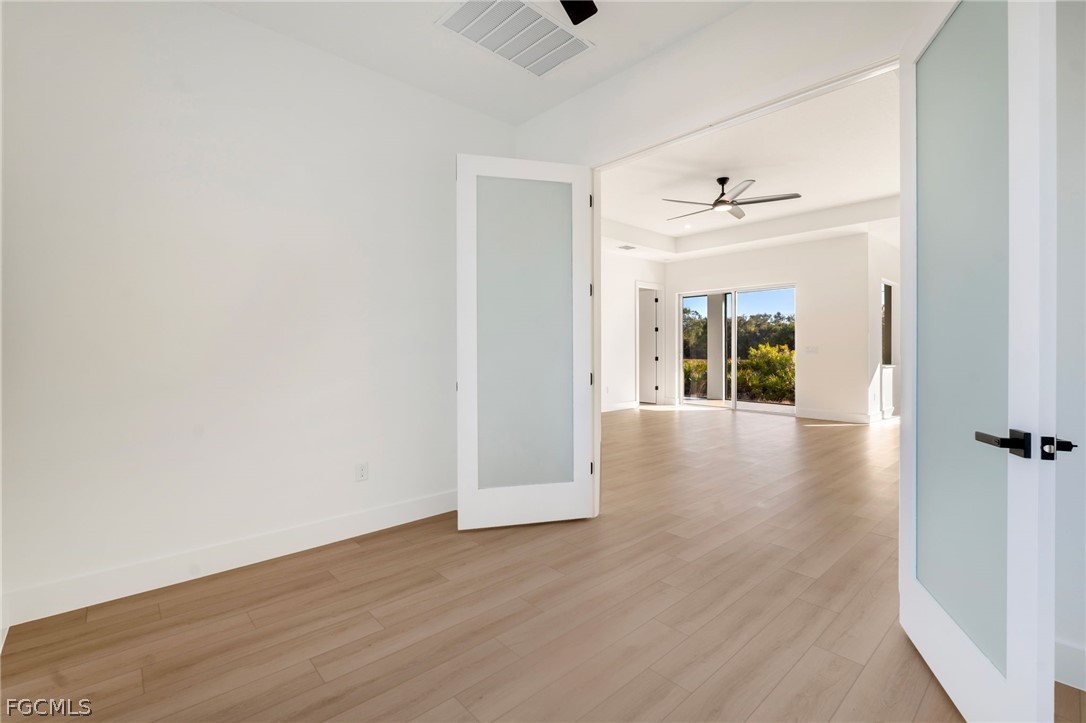 95 Brig Circle East Placida, FL 33946 - Photo 6 of 25 a view of a hallway with wooden floor and closet