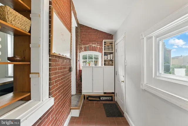a view of a house with a door and a window