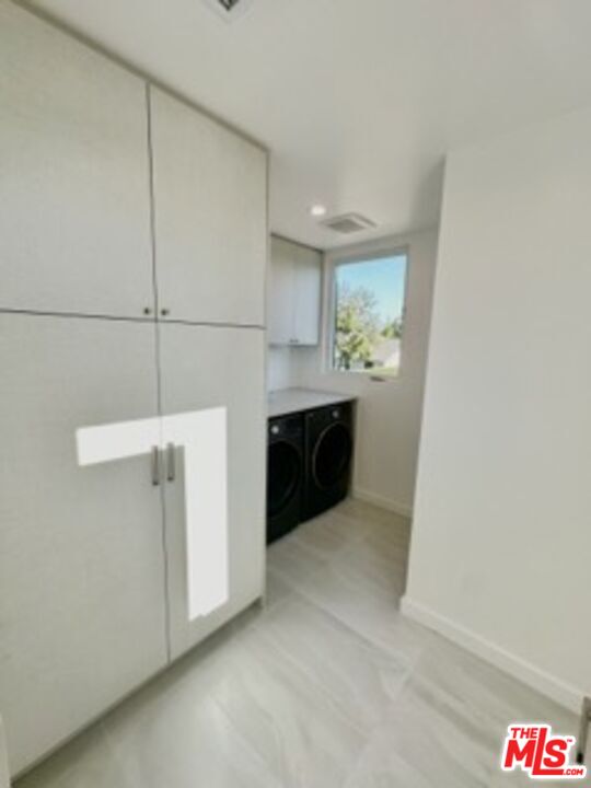 4805 Matilija Avenue Sherman Oaks, CA 91423 - Photo 18 of 22 a bathroom with a sink and mirror