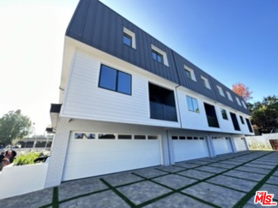 4805 Matilija Avenue Sherman Oaks, CA 91423 - Photo 19 of 22 a front view of a house with a yard