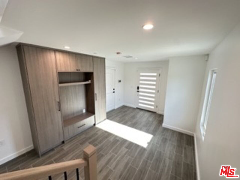 4805 Matilija Avenue Sherman Oaks, CA 91423 - Photo 5 of 22 an empty room with wooden floor and entrance