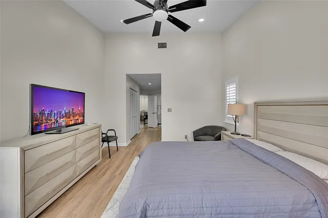 a bedroom with furniture and a flat screen tv
