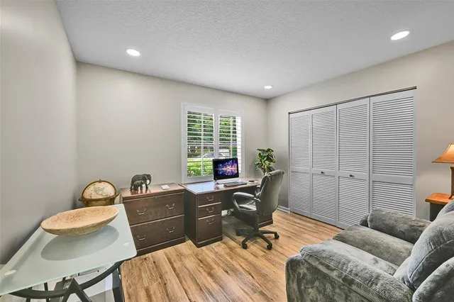 a workspace with furniture and window