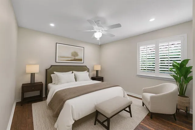 a bedroom with a large bed and a window