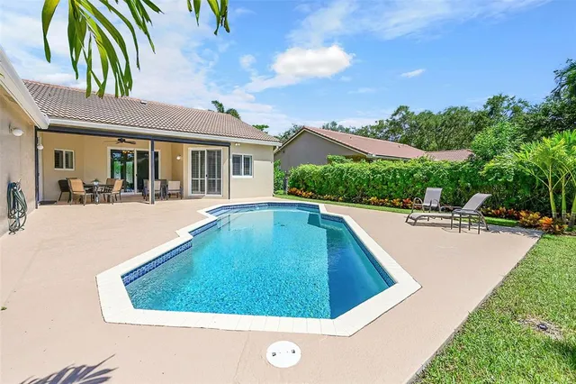 a view of a swimming pool with a patio