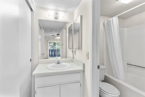 a wooden fence with trees in the background