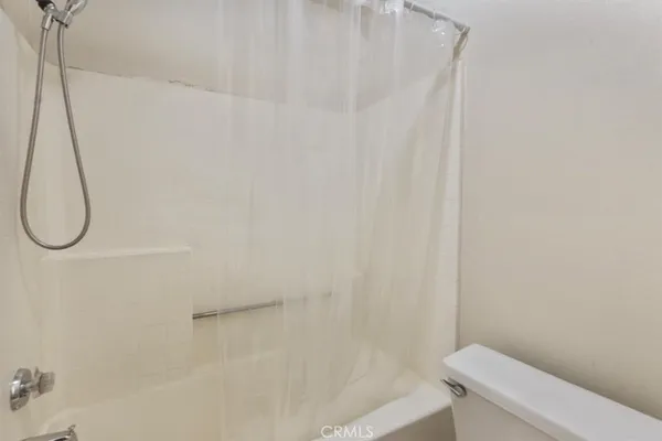 a view of a porch with wooden floor