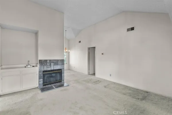 a kitchen with a stove and a fireplace