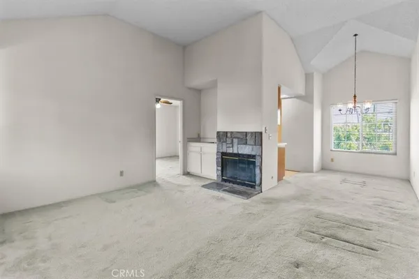 a kitchen with a stove a sink and a microwave