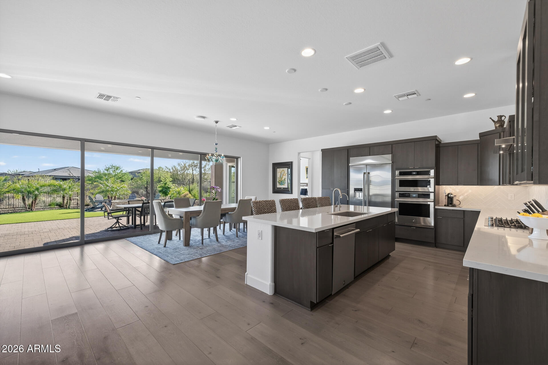18205 East Juniper Oaks Drive Rio Verde, AZ 85263 - Photo 15 of 77 a large kitchen with a table and chairs in it
