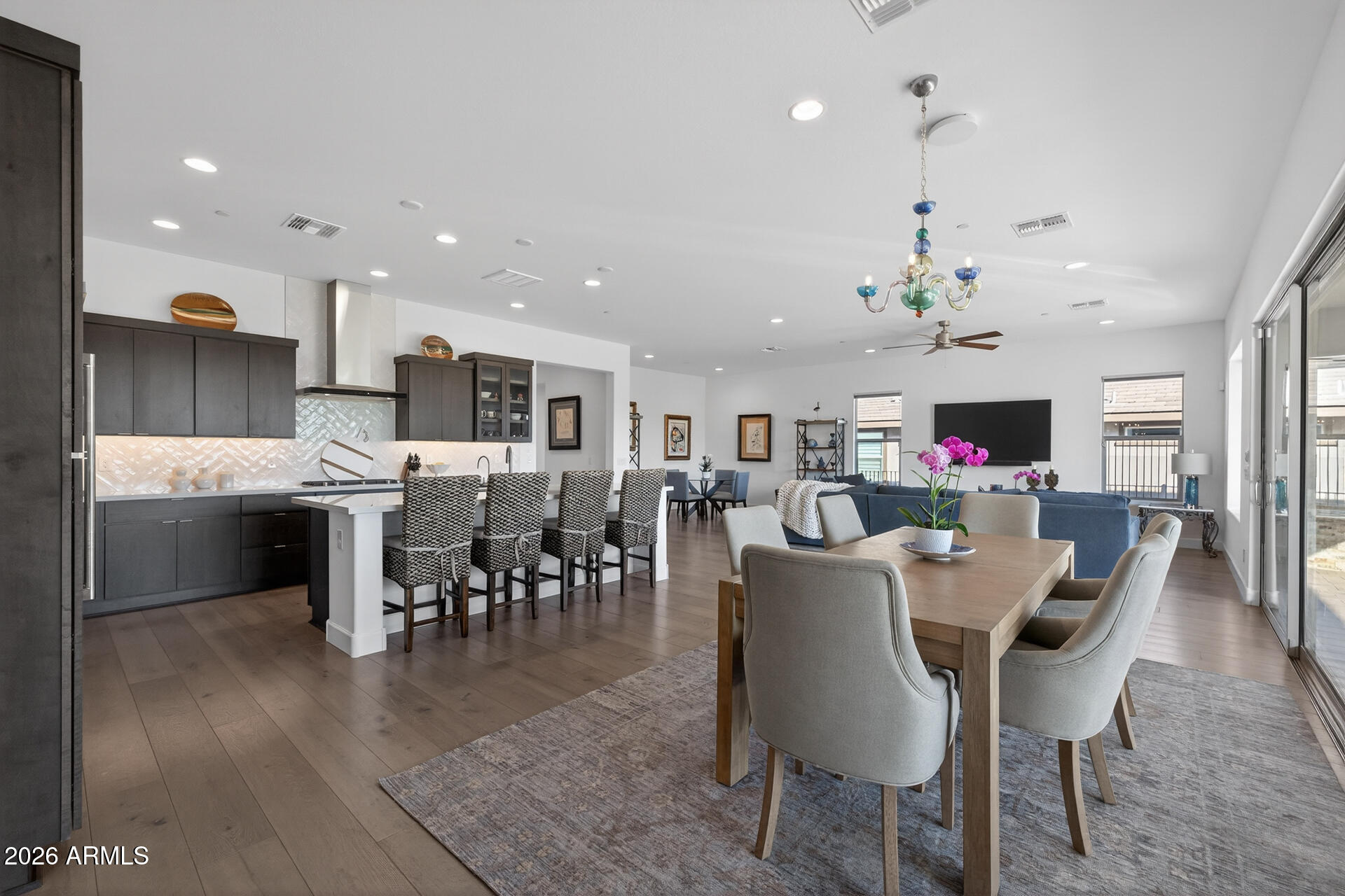 18205 East Juniper Oaks Drive Rio Verde, AZ 85263 - Photo 20 of 77 a view of a dining room with furniture and wooden floor