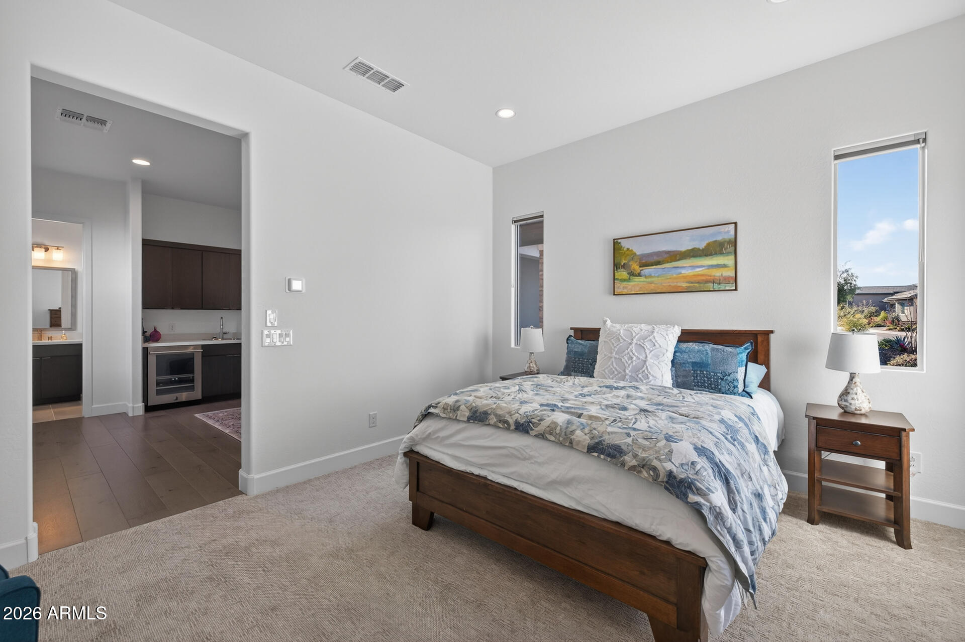 18205 East Juniper Oaks Drive Rio Verde, AZ 85263 - Photo 26 of 77 a spacious bedroom with a bed and a view of kitchen