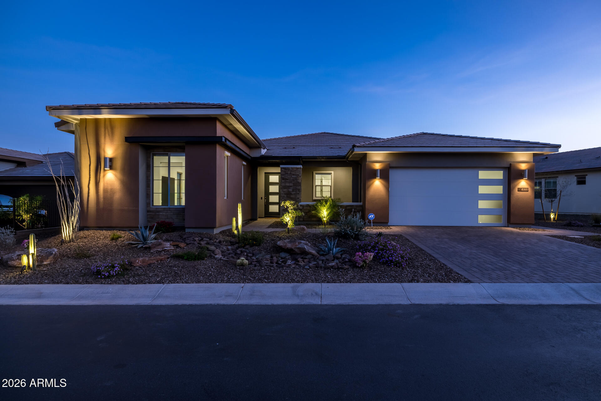 18205 East Juniper Oaks Drive Rio Verde, AZ 85263 - Photo 2 of 77 a front view of a house with garden