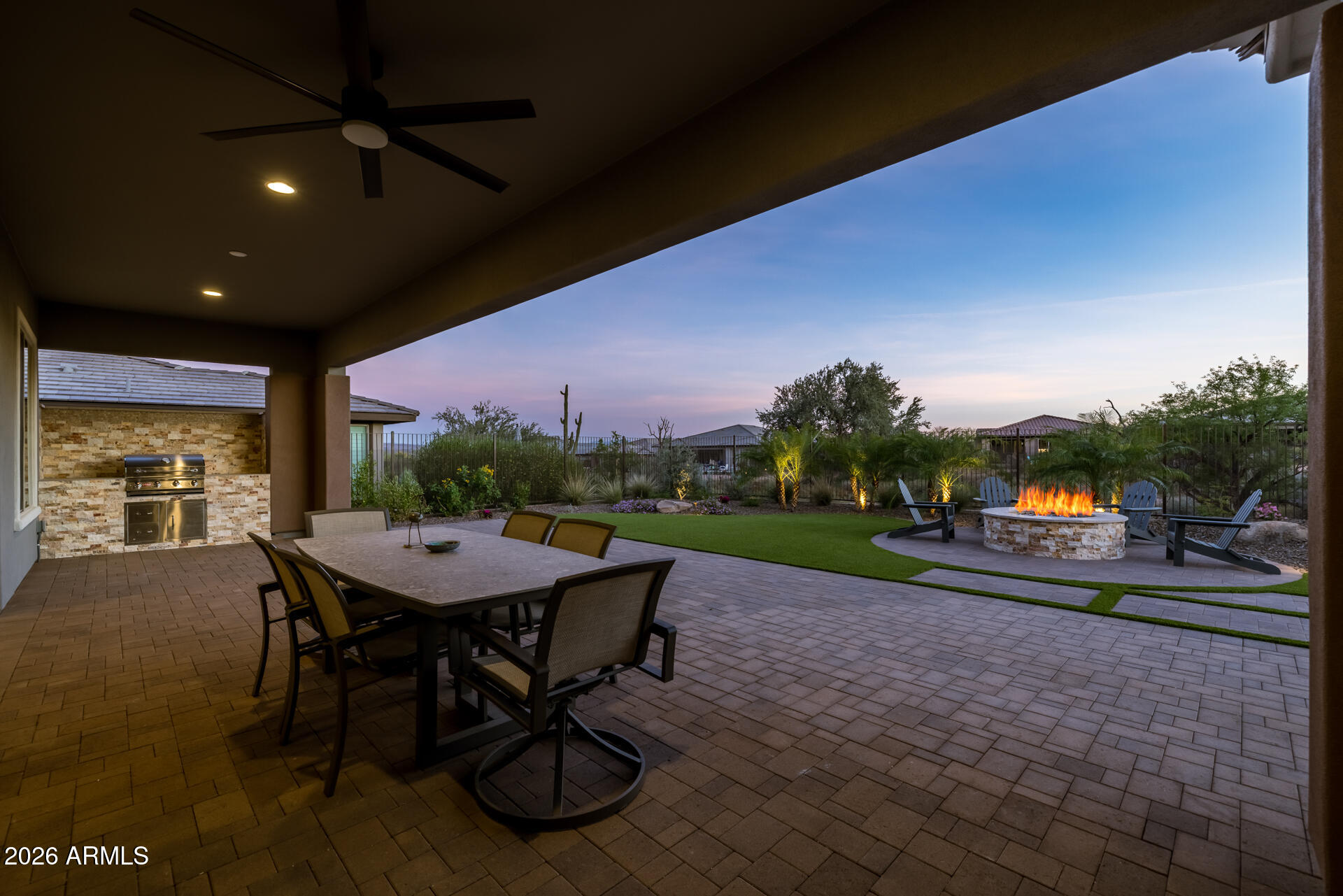 18205 East Juniper Oaks Drive Rio Verde, AZ 85263 - Photo 41 of 77 a view of a patio with table and chairs floor to ceiling window with outer view