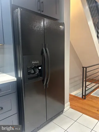 a bathroom with a glass shower door and a window