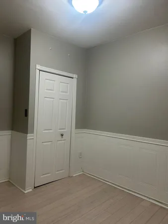 an empty room with wooden floor