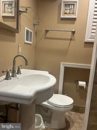 a bathroom with a sink and a toilet