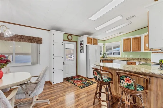 a kitchen that has a sink and a stove in it