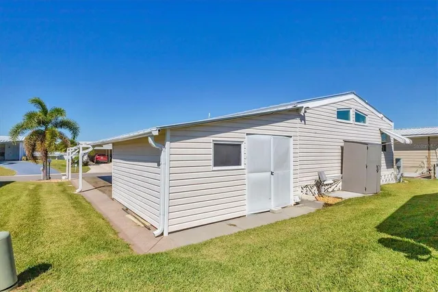 a room with pool table and windows