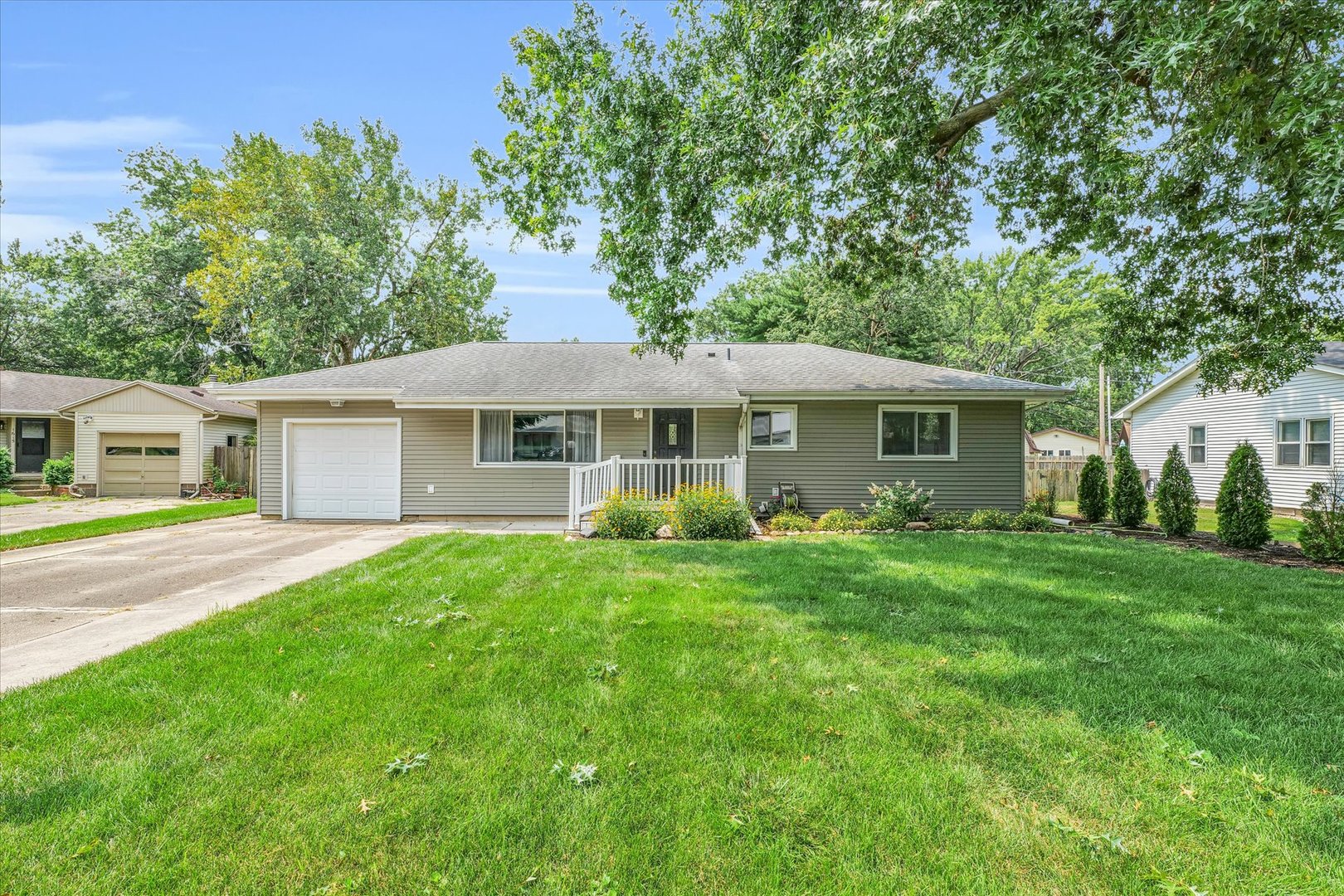 1617 Cornell Drive Champaign, IL 61821 - Photo 1 of 31 a front view of a house with a garden