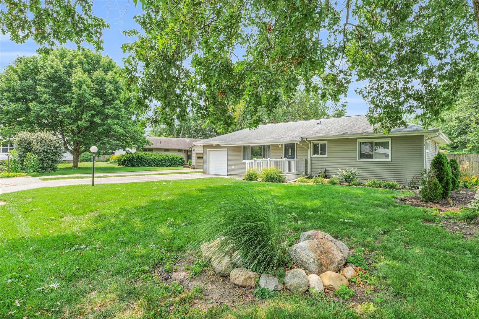 1617 Cornell Drive Champaign, IL 61821 - Photo 2 of 31 a view of a house with a backyard and a tree