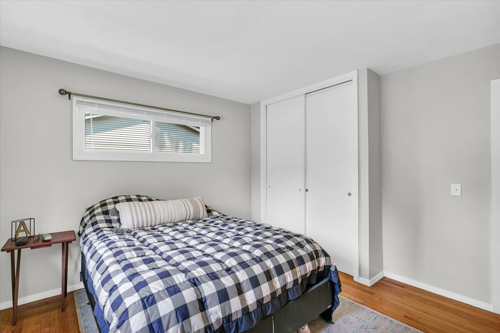 1617 Cornell Drive Champaign, IL 61821 - Photo 22 of 31 a bedroom with a bed and wooden floor