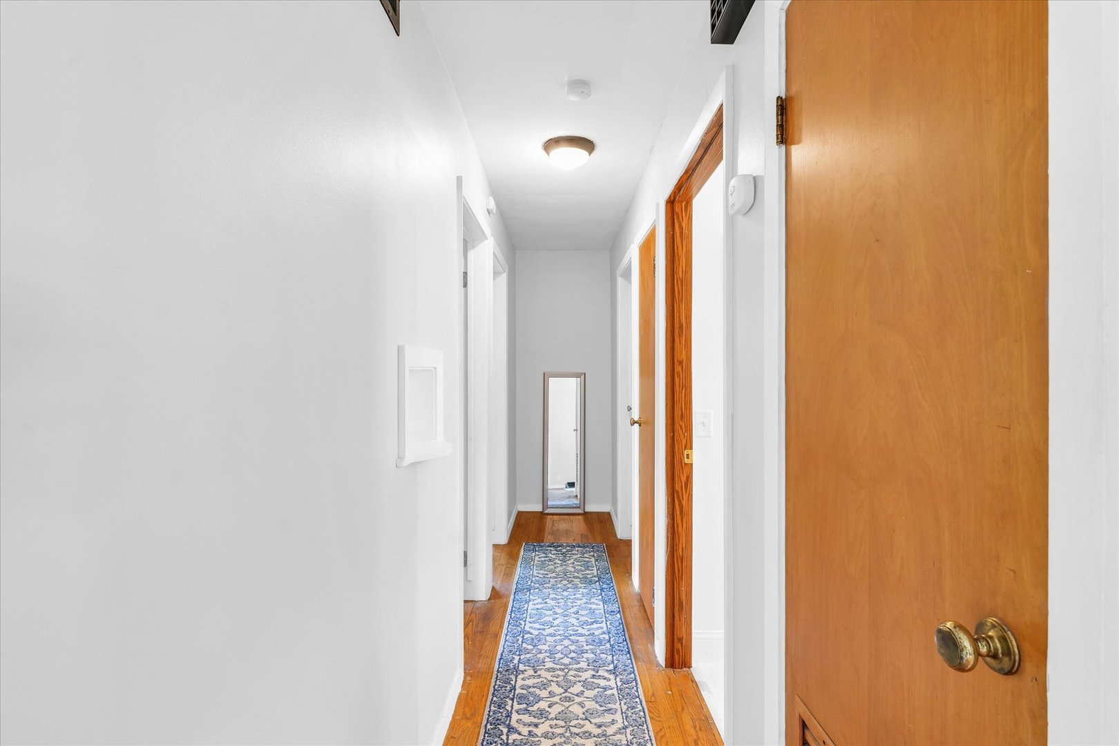 1617 Cornell Drive Champaign, IL 61821 - Photo 24 of 31 a view of a hallway with wooden floor and staircase