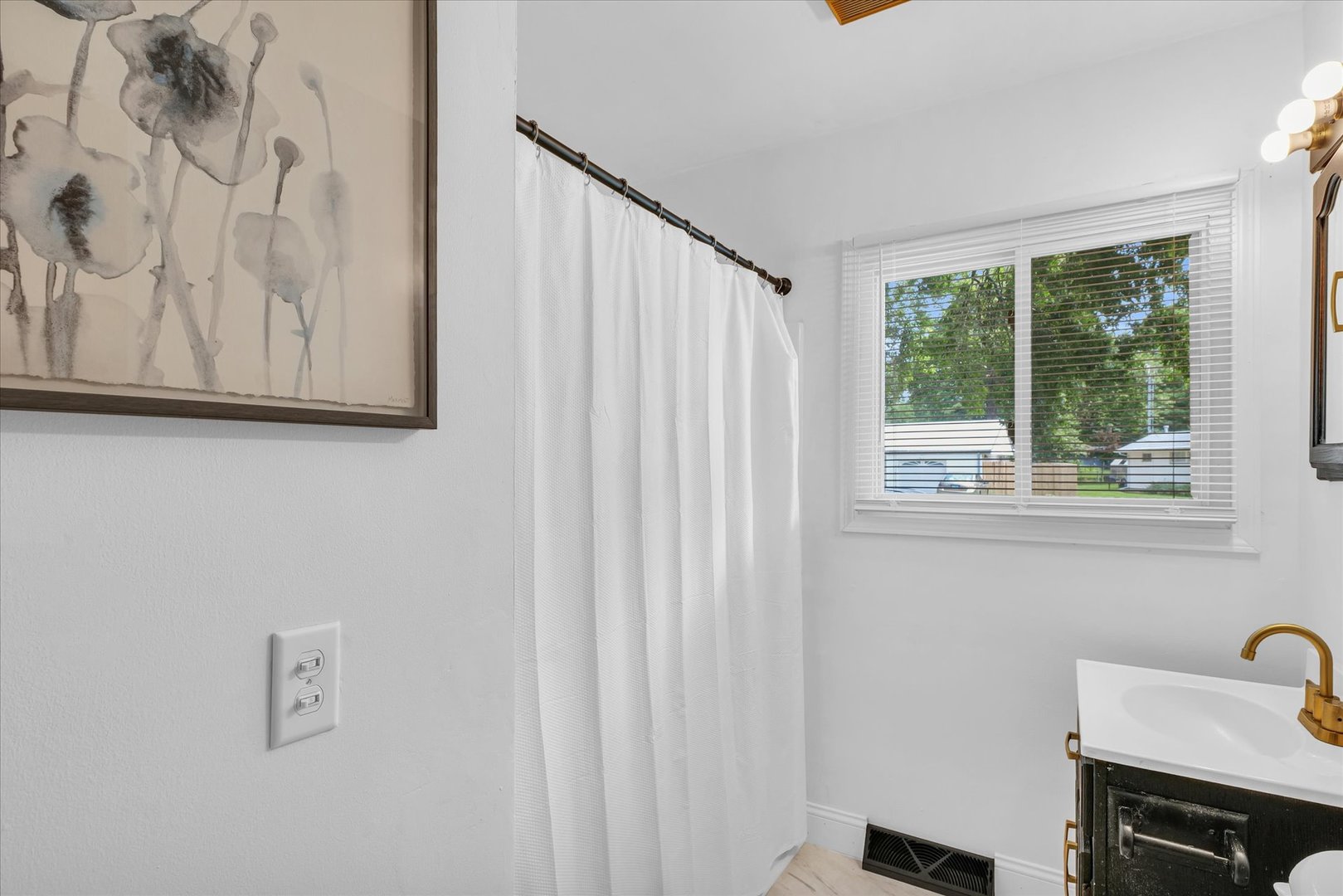 1617 Cornell Drive Champaign, IL 61821 - Photo 27 of 31 a bathroom with a window and a shower curtain