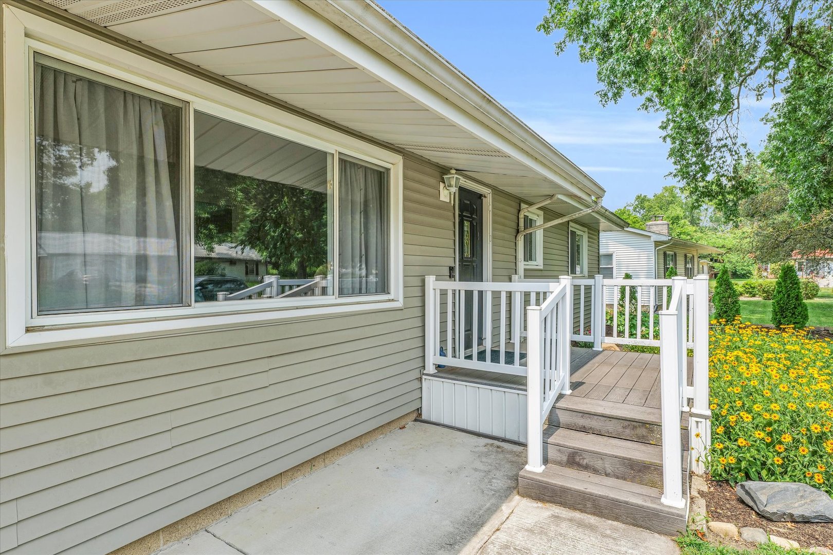 1617 Cornell Drive Champaign, IL 61821 - Photo 3 of 31 a view of a porch with a bench