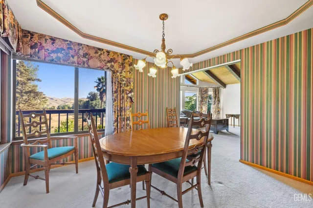 a kitchen with stainless steel appliances granite countertop a refrigerator a sink dishwasher and wooden cabinets with a dishwasher