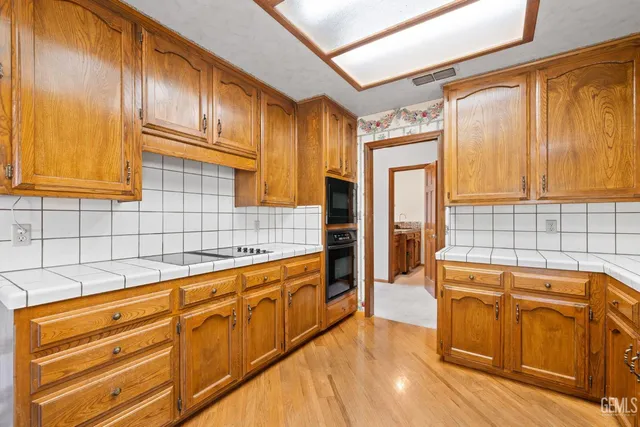a view of a room with a fireplace and a window