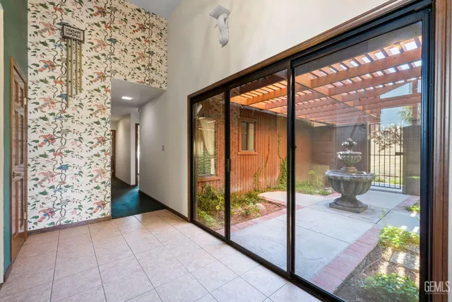 a spacious bathroom with a double vanity sink a large mirror and a bathtub