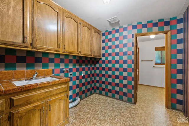 a bathroom with a bathtub and a sink