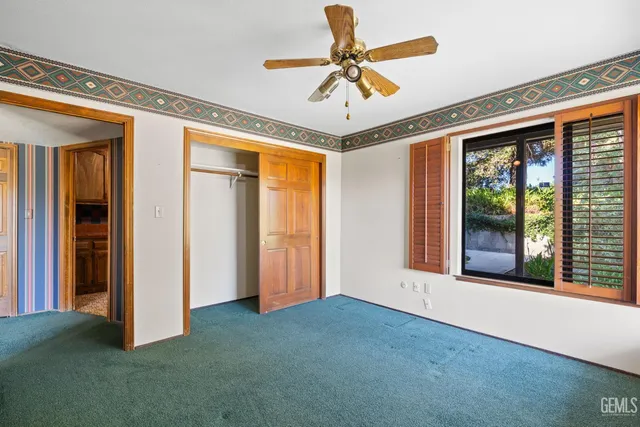 a bathroom with a shower and a toilet