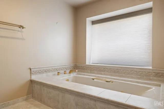 a view of a wooden deck next to a yard