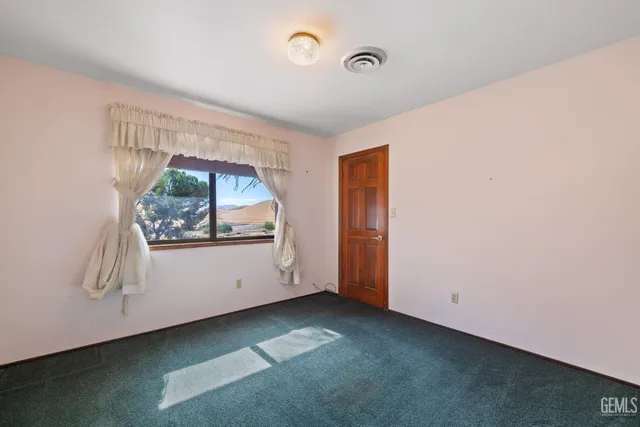 a balcony with wooden floor and outdoor space