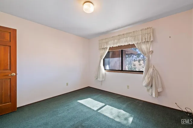 a view of swimming pool from a balcony