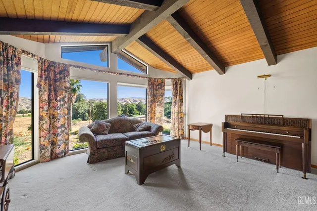 a view of a kitchen with a sink and a fireplace