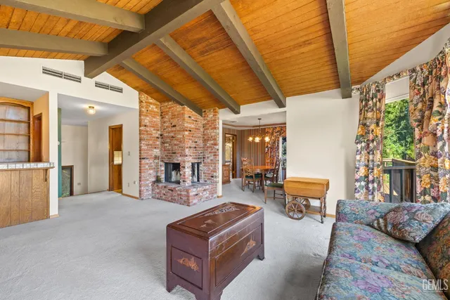 a kitchen with stainless steel appliances granite countertop a sink a stove and cabinets