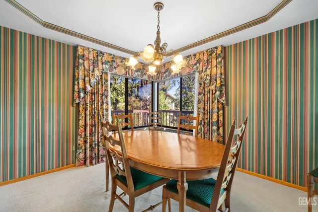 a kitchen with stainless steel appliances granite countertop wooden cabinets a sink and dishwasher