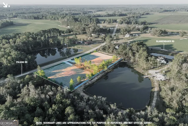 an aerial view of residential houses with outdoor space and lake view