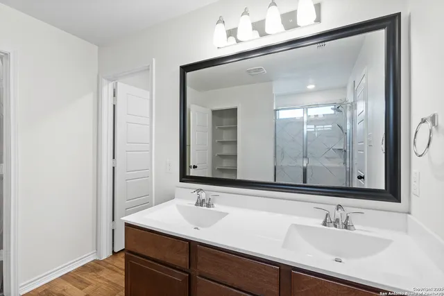 a bathroom with a sink and a mirror