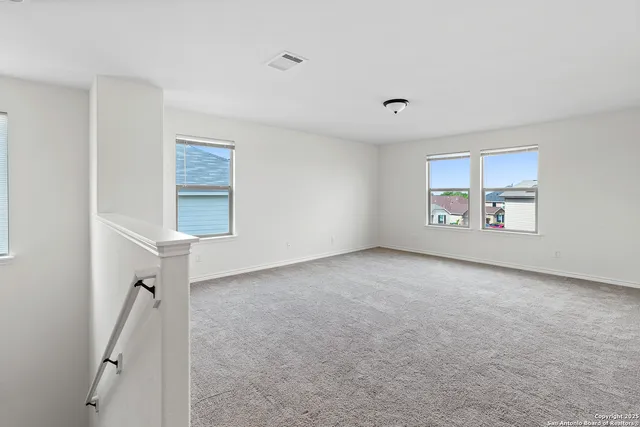 a view of a livingroom with a dishwasher and a window