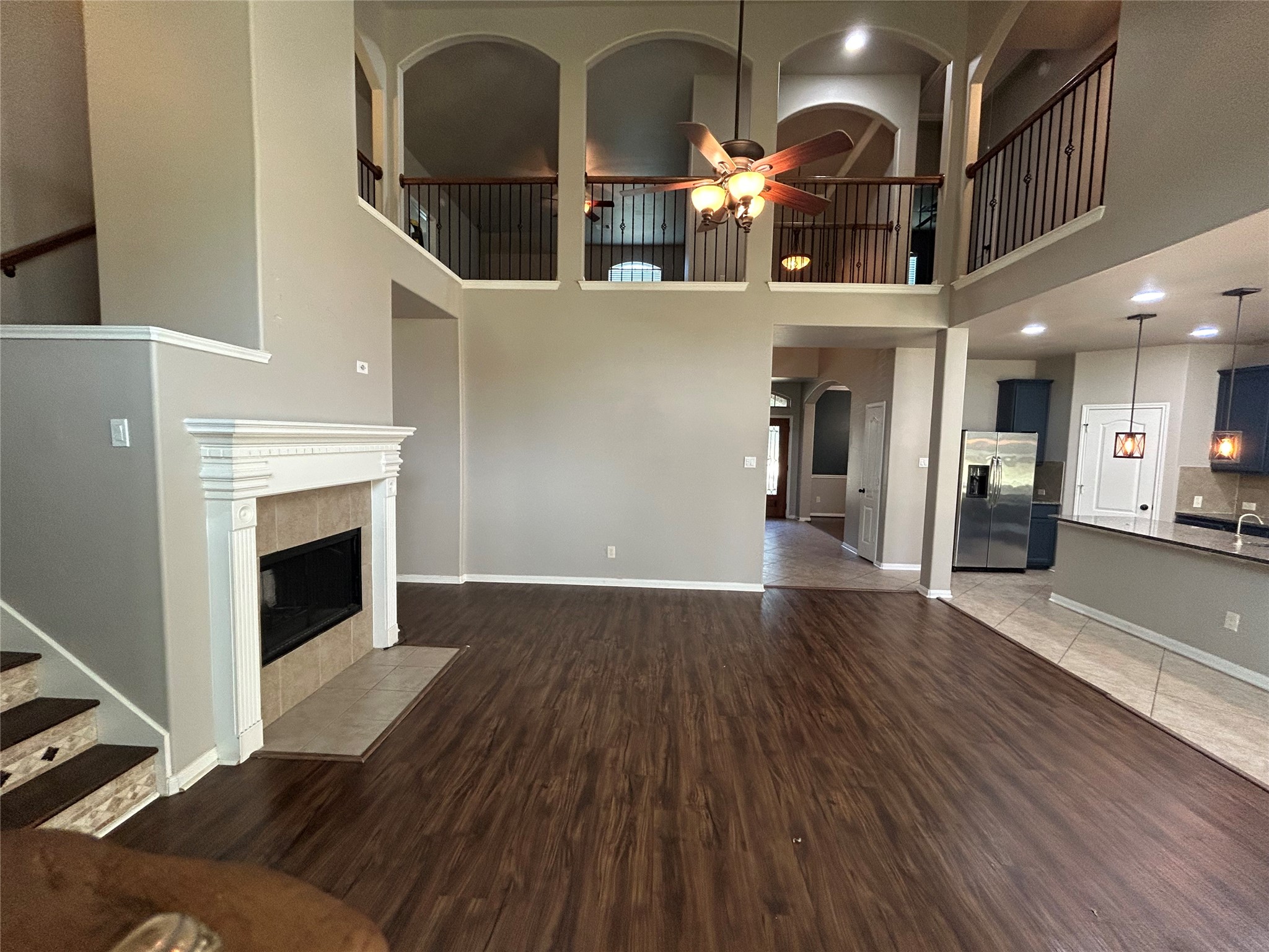 7936 Lake Commons Drive Rosenberg, TX 77469 - Photo 11 of 34 a view of a living room a fireplace with wooden floor