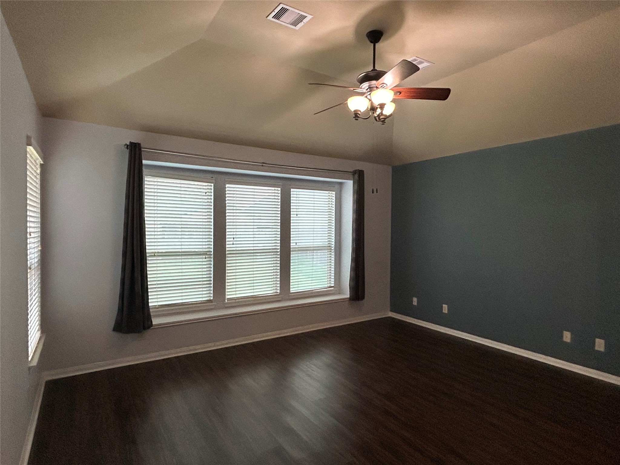 7936 Lake Commons Drive Rosenberg, TX 77469 - Photo 25 of 34 a view of an empty room with wooden floor and a window