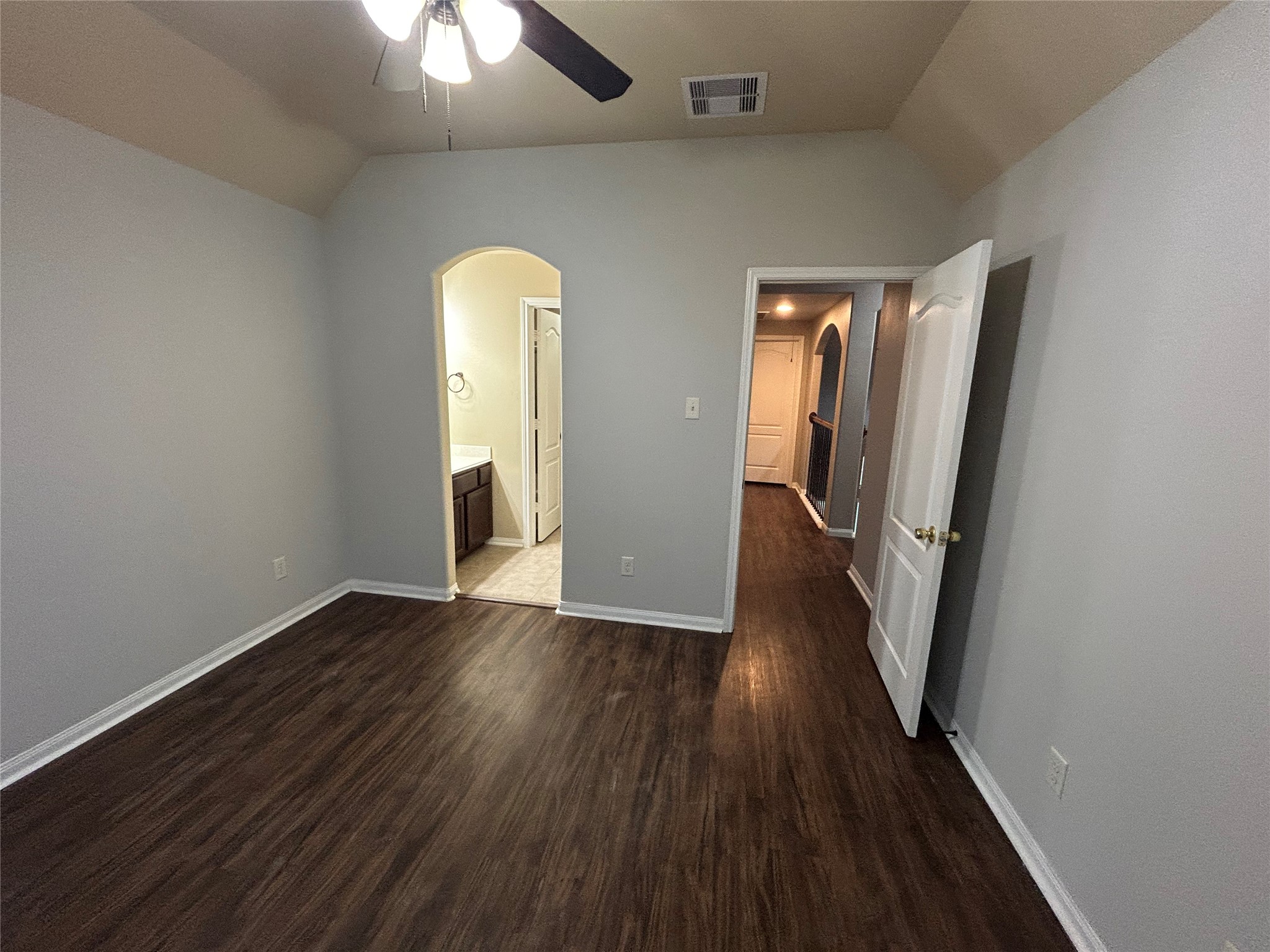 7936 Lake Commons Drive Rosenberg, TX 77469 - Photo 29 of 34 an empty room with wooden floor and mirror