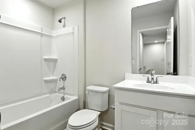 a bathroom with a bathtub and a toilet