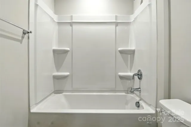 a view of a bathroom with sink and mirror